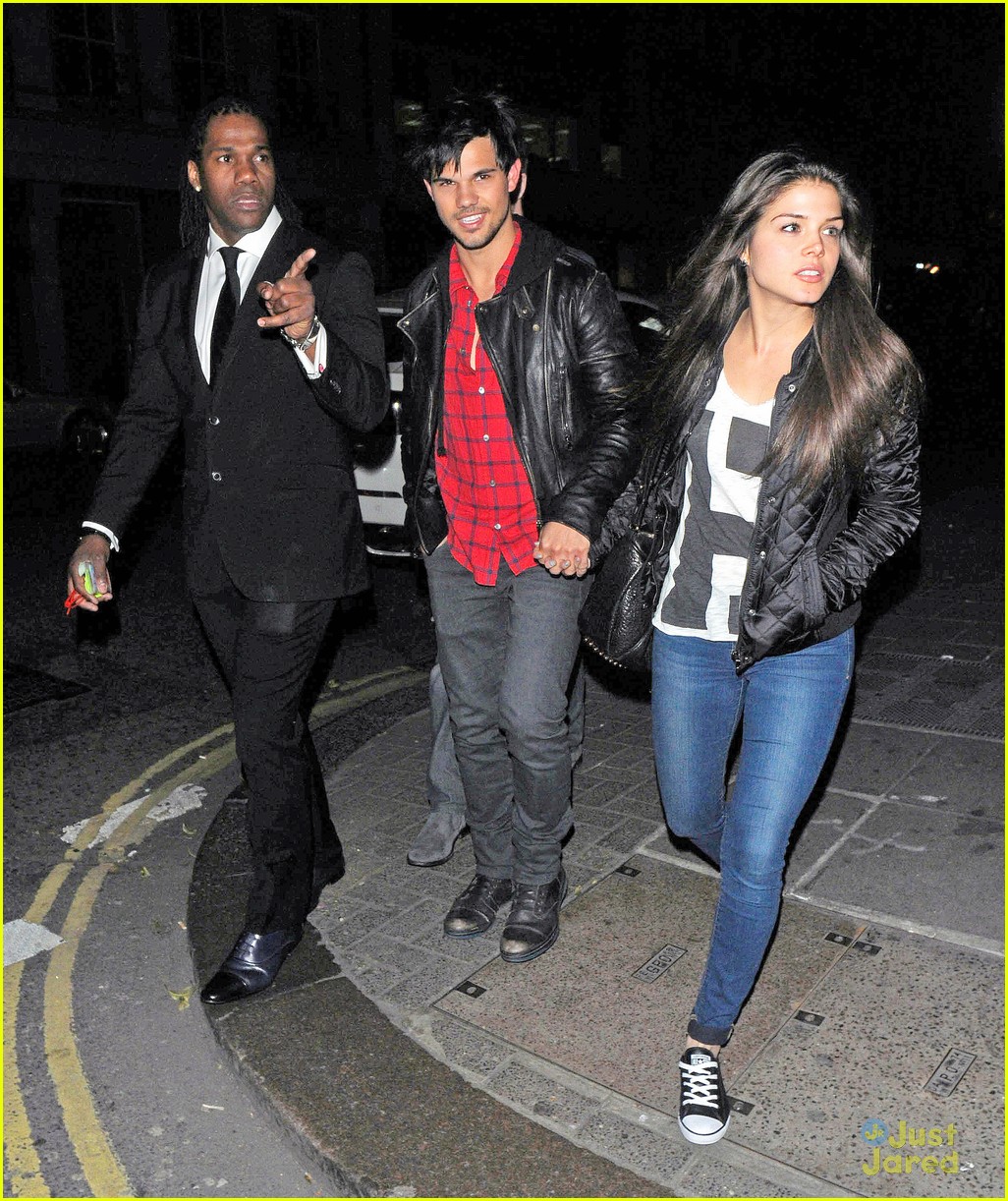 taylor lautner marie avgeropoulos matching jackets london 16